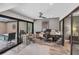 Bright office with a ceiling fan and sliding glass doors that overlook the sparkling pool at 3955 Glen Oaks Manor Dr, Sarasota, FL 34232