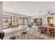 Spacious open floor plan blending kitchen, dining, and living spaces, with views of the pool and backyard at 3955 Glen Oaks Manor Dr, Sarasota, FL 34232