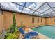 Inviting pool area with comfortable lounge chairs and lush landscaping, perfect for relaxation at 3955 Glen Oaks Manor Dr, Sarasota, FL 34232