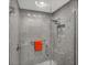 Glass enclosed shower features gray subway tile, a rainfall showerhead and a built-in niche at 3955 Glen Oaks Manor Dr, Sarasota, FL 34232