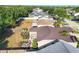 An aerial view of the backyard with a patio set and manicured landscaping at 4211 Kingsfield Dr, Parrish, FL 34219