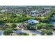 Aerial shot showcasing community pool surrounded by lush landscaping and amenities at 4211 Kingsfield Dr, Parrish, FL 34219