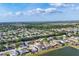 Beautiful aerial view of a lakeside community with mature trees and well-maintained homes at 4211 Kingsfield Dr, Parrish, FL 34219
