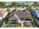 An aerial view showing the backyard with a cozy patio area and lush landscaping at 4211 Kingsfield Dr, Parrish, FL 34219