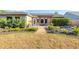 Charming backyard featuring a pergola-covered patio and artful landscaping at 4211 Kingsfield Dr, Parrish, FL 34219