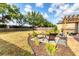 Spacious backyard with a fire pit and lounge area, perfect for outdoor enjoyment at 4211 Kingsfield Dr, Parrish, FL 34219