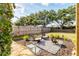 Cozy backyard with inviting lounge chairs and a charming fire pit area at 4211 Kingsfield Dr, Parrish, FL 34219