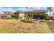 A peaceful backyard with a patio area and lush, well-maintained greenery at 4211 Kingsfield Dr, Parrish, FL 34219