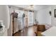 Unique bedroom with decorative mannequins, hardwood floors, natural lighting and stylish accent chair at 4211 Kingsfield Dr, Parrish, FL 34219