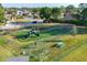 Aerial view of a community playground featuring slides, swings and picnic benches at 4211 Kingsfield Dr, Parrish, FL 34219
