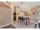 Bright dining area featuring tile floors, decorative walls, and views of the kitchen at 4211 Kingsfield Dr, Parrish, FL 34219