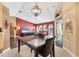 Dining area features neutral colors, tile flooring, and open access to the living room at 4211 Kingsfield Dr, Parrish, FL 34219