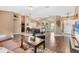 Open living space with tile and hardwood floors, connected to the dining and kitchen areas at 4211 Kingsfield Dr, Parrish, FL 34219