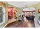Living room with dark wood flooring, arched doorways, and view into other rooms at 4211 Kingsfield Dr, Parrish, FL 34219