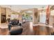 Open concept living area with archways, neutral paint, wood floors, and access to the entry at 4211 Kingsfield Dr, Parrish, FL 34219