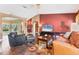 Open concept living area with wood floors, comfortable furniture, and plenty of natural light at 4211 Kingsfield Dr, Parrish, FL 34219