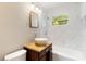 Updated bathroom with marble tile and vessel sink at 4229 Alna Way, Sarasota, FL 34232