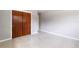 Spacious bedroom featuring a closet and terrazzo flooring at 4229 Alna Way, Sarasota, FL 34232