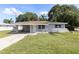 Charming single-story home with a covered carport and well-maintained front lawn at 4229 Alna Way, Sarasota, FL 34232