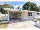 Charming single-story home with a carport and well-maintained front yard at 4229 Alna Way, Sarasota, FL 34232