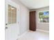 Entryway with terrazzo floors, closet, window, and exterior door at 4229 Alna Way, Sarasota, FL 34232