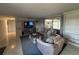 Relaxing living room featuring built-in shelves, comfortable seating, and sliding glass doors to outdoor at 4411 Dolphin Ln, Palmetto, FL 34221