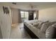 Cozy main bedroom with carpeting, a ceiling fan, and neutral walls at 4411 Dolphin Ln, Palmetto, FL 34221