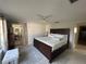 Well-lit main bedroom with carpeting, a ceiling fan, and a sliding glass door at 4411 Dolphin Ln, Palmetto, FL 34221