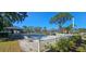 Recreational area including tennis courts and covered seating, with lush greenery surrounding the space at 4415 45Th W Ave # 203, Bradenton, FL 34210