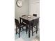 Dining area with modern table, chairs, and a wall clock at 4415 45Th W Ave # 203, Bradenton, FL 34210