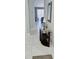 Inviting entryway with tile flooring, stylish console table and grey wall color at 4415 45Th W Ave # 203, Bradenton, FL 34210