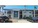 Two story condo building with palm trees and parking in front at 4415 45Th W Ave # 203, Bradenton, FL 34210