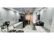 A bright modern kitchen with gray cabinets, stainless appliances and counter seating at 4415 45Th W Ave # 203, Bradenton, FL 34210