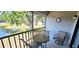 Relaxing screened lanai with a seating area and serene water view, creating a peaceful retreat at 4415 45Th W Ave # 203, Bradenton, FL 34210