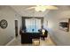 Open-concept living area with tile flooring, a comfortable leather sofa, and sliding glass doors at 4415 45Th W Ave # 203, Bradenton, FL 34210