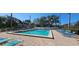 Community swimming pool with ample seating, perfect for relaxation and recreation at 4415 45Th W Ave # 203, Bradenton, FL 34210
