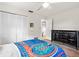 Bedroom with a large closet, a dark dresser and ceiling fan at 4415 Charing Cross Rd, Sarasota, FL 34241