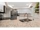 A well-appointed kitchen boasts granite countertops and stainless steel appliances, ready for culinary creations at 4415 Charing Cross Rd, Sarasota, FL 34241