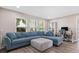 Comfortable living room featuring a sofa, desk, and plenty of natural light at 4415 Charing Cross Rd, Sarasota, FL 34241
