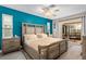 Comfortable main bedroom with ceiling fan and sliding glass doors leading to a screened lanai at 4415 Charing Cross Rd, Sarasota, FL 34241