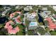 Aerial shot capturing a community featuring amenities like pools and tennis courts, nestled among ponds and trees at 4505 45Th W Ave # 101B, Bradenton, FL 34210