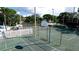 Basketball court inside a fenced-in tennis court, providing recreational options for active residents at 4505 45Th W Ave # 101B, Bradenton, FL 34210