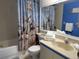 Charming bathroom featuring a decorative seashell shower curtain and classic fixtures at 4505 45Th W Ave # 101B, Bradenton, FL 34210