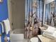 Bathroom with seashell-themed shower curtain, offering both bath and shower functionality at 4505 45Th W Ave # 101B, Bradenton, FL 34210