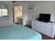 Bright bedroom with updated decor, modern dresser, and an ensuite bathroom at 4505 45Th W Ave # 101B, Bradenton, FL 34210