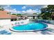 A large pool featuring clear blue water and surrounding lounge area for relaxation and recreation in the community at 4505 45Th W Ave # 101B, Bradenton, FL 34210