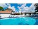 Relax by the pool featuring clear water and marked lanes, set in a community with lounge chairs and maintained landscaping at 4505 45Th W Ave # 101B, Bradenton, FL 34210
