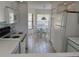 Bright kitchen that flows into a breakfast nook with tile flooring and modern appliances at 4505 45Th W Ave # 101B, Bradenton, FL 34210