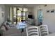 Bright living room with screened balcony access and view of the water at 4505 45Th W Ave # 101B, Bradenton, FL 34210