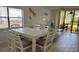 Bright living room and dining room combination with screened lanai access at 4505 45Th W Ave # 101B, Bradenton, FL 34210